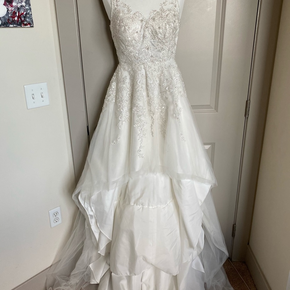 Wedding dress. Fits size XS or S. Ivory color.